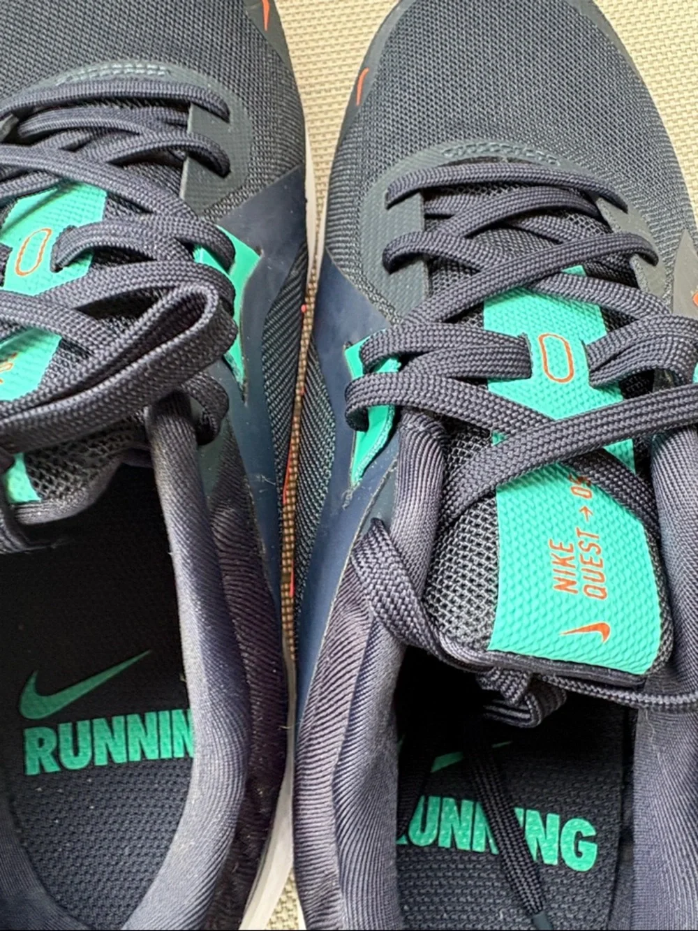 Nike Stylish Navy and Teal Women’s Running Sneakers with Orange Swoosh